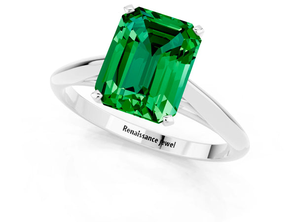 White gold Emerald Cut Emerald Solitaire Engagement Ring with Cathedral Setting and Four-Prong Mount