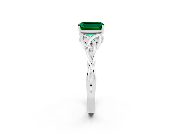 Platinum Emerald Cut Emerald Solitaire Engagement Ring with Celtic Knot Band and Four-Prong Setting