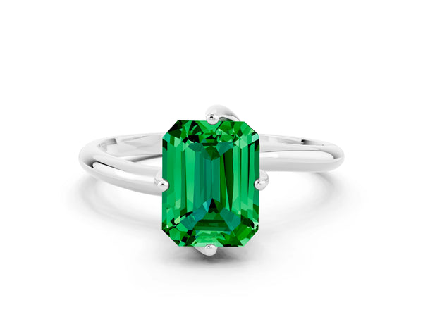 Platinum Emerald Cut Emerald Solitaire Engagement Ring with Four-Prong Setting and Classic Band