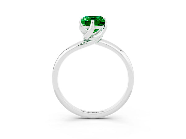Platinum Emerald Cut Emerald Solitaire Engagement Ring with Four-Prong Setting and Classic Band