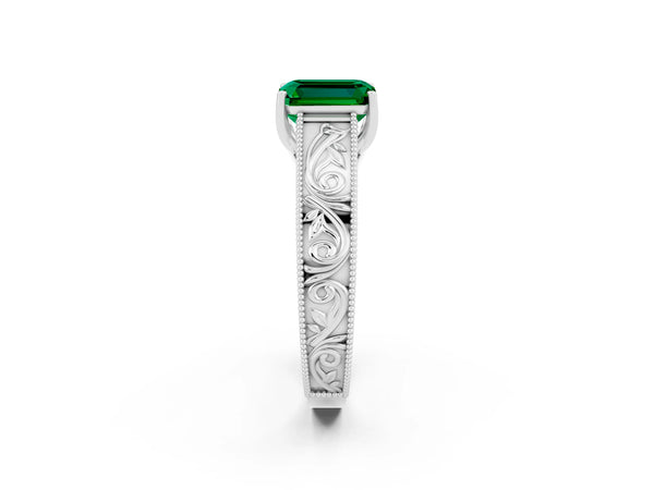 Platinum Emerald Cut Emerald Solitaire Ring with Engraved Band and Four-Prong Setting