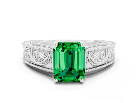 White gold Emerald Cut Emerald Solitaire Ring with Engraved Band and Four-Prong Setting