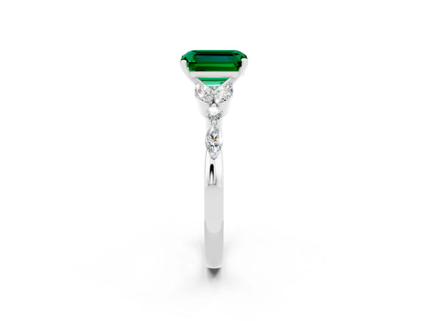Platinum Emerald Cut Emerald Solitaire Ring with Side Stones and Four-Prong Setting