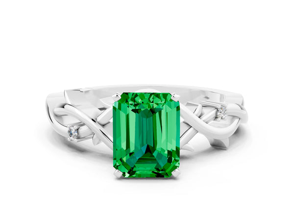 White gold Emerald Cut Emerald Solitaire Ring with Twisted Band and Prong Setting