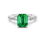 White gold Emerald Cut Emerald Solitaire with Side Baguettes and Channel Set Band