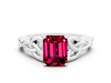 White gold Emerald Cut Garnet Solitaire Engagement Ring with Celtic Knot Band and Four-Prong Setting
