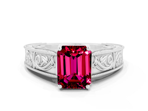 White gold Emerald Cut Garnet Solitaire Ring with Engraved Band and Four-Prong Setting