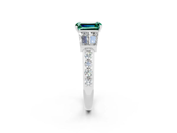 Platinum Emerald Cut Green Sapphire Engagement Ring with Baguette Side Stones and Channel Set Band