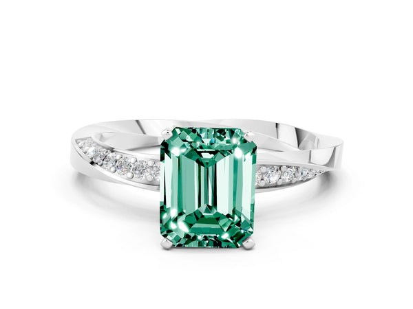 Silver Emerald Cut Green Sapphire Engagement Ring with Side Stone Accents and Four-Prong Setting