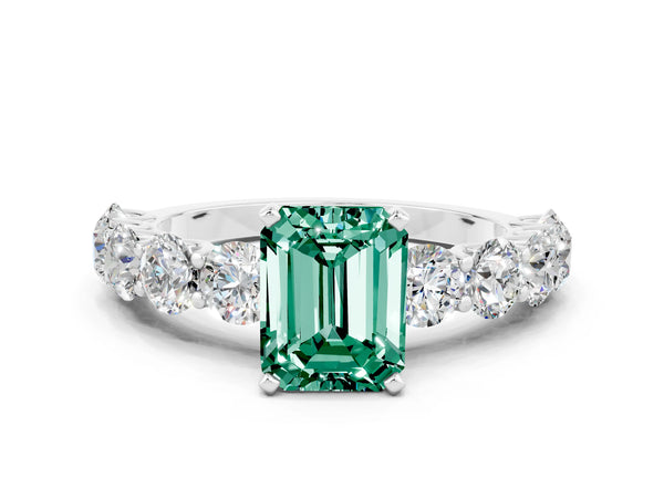 Platinum Emerald Cut Green Sapphire Prong Setting with Side Stones on a Pave Band