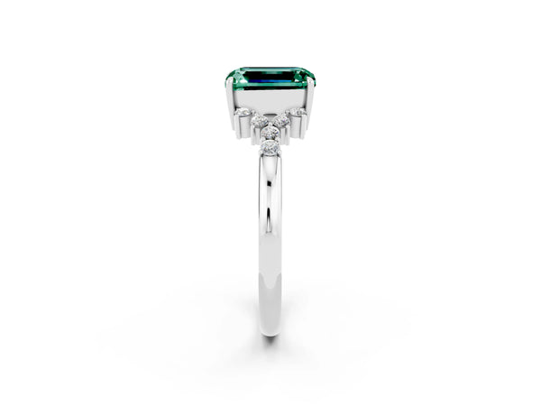 Silver Emerald Cut Green Sapphire Ring with Side Stones and Four-Prong Setting