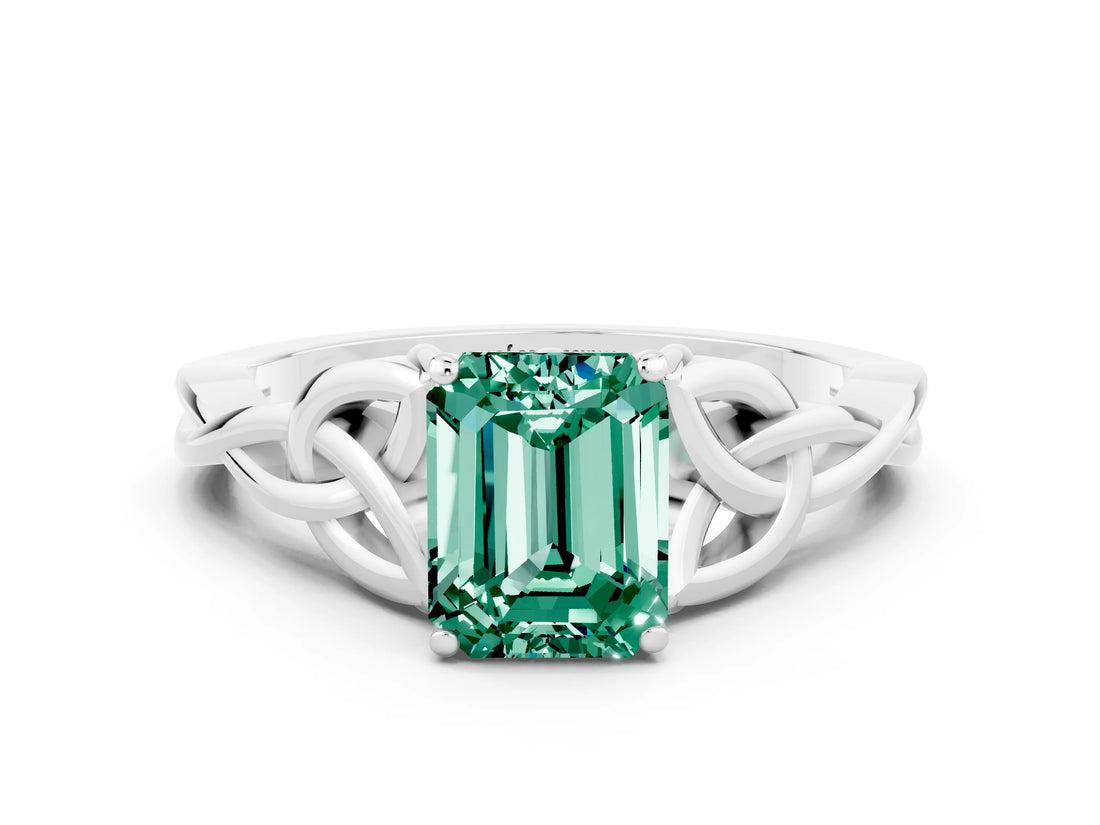 White gold Emerald Cut Green Sapphire Solitaire Engagement Ring with Celtic Knot Band and Four-Prong Setting