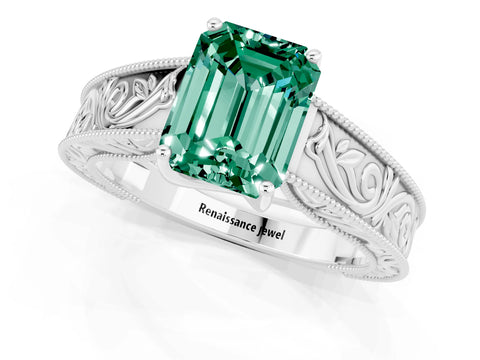 White gold Emerald Cut Green Sapphire Solitaire Ring with Engraved Band and Four-Prong Setting_1