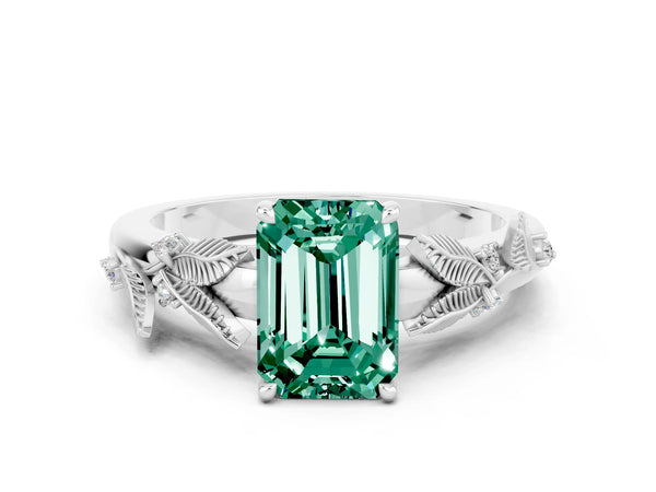 White gold Emerald Cut Green Sapphire Solitaire Ring with Leaf Motif Band and Four-Prong Setting