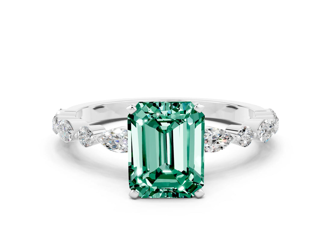 White gold Emerald Cut Green Sapphire Solitaire with Side Stones on a Pavé Band and Four-Prong Setting