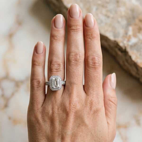 White gold Emerald Cut Halo Diamond Ring with Pavé Band and Four-Prong Setting