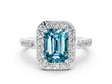 White gold Emerald Cut Halo Diamond Ring with Pavé Band and Three-Prong Setting