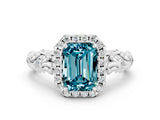 White gold Emerald Cut Halo Diamond Solitaire with Filigree Band and Four-Prong Setting