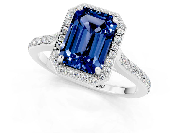 Platinum Emerald Cut Blue Sapphire Halo Engagement Ring with Round Pavé Shoulders and Prong Setting