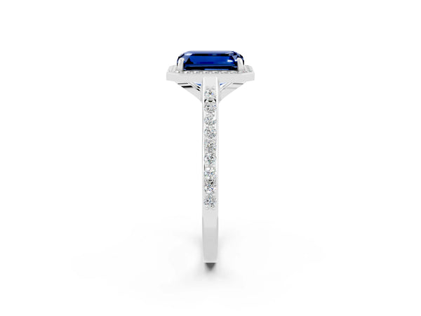 Platinum Emerald Cut Blue Sapphire Halo Engagement Ring with Round Pavé Shoulders and Prong Setting
