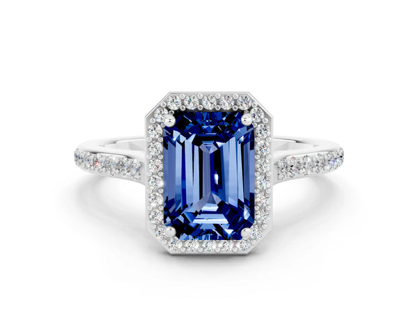 Platinum Emerald Cut Blue Sapphire Halo Engagement Ring with Round Pavé Shoulders and Prong Setting