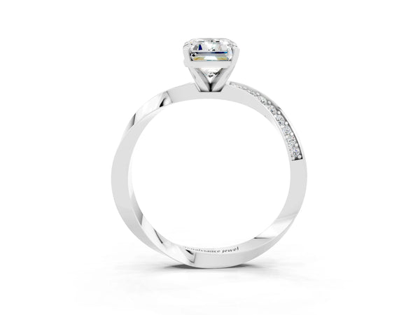 Platinum Emerald Cut Moissanite Engagement Ring with Side Stone Accents and Four-Prong Setting