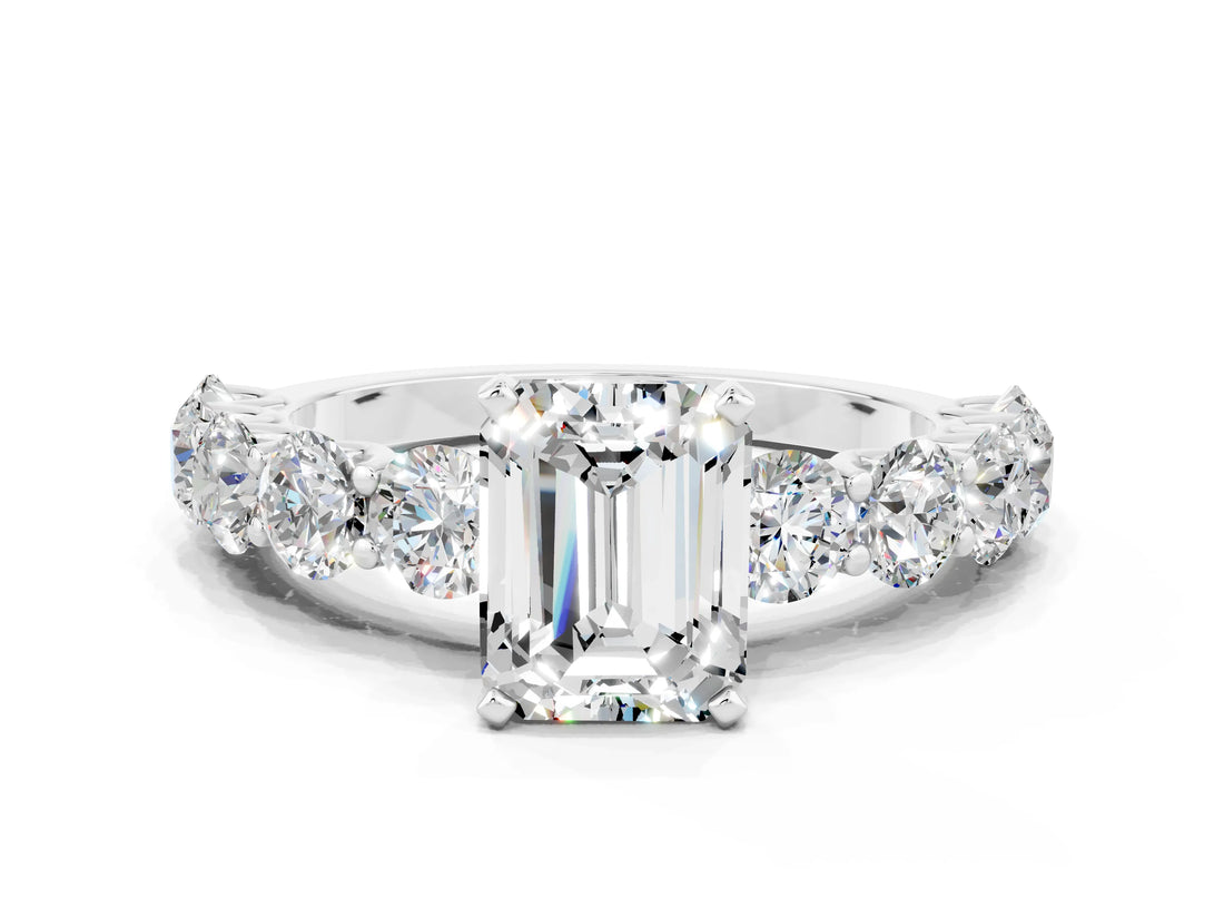 White gold Emerald Cut Moissanite Prong Setting with Side Stones on a Pave Band