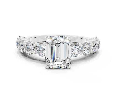 White gold Emerald Cut Moissanite Prong Setting with Side Stones on a Pave Band