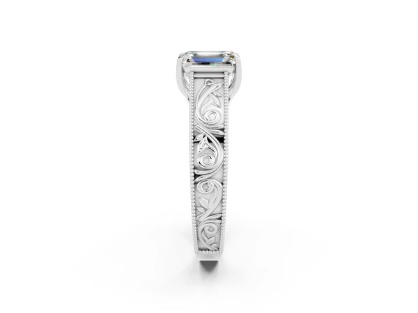 White gold Emerald Cut Moissanite Solitaire Ring with Engraved Band and Four-Prong Setting