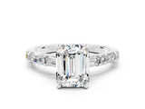 White gold Emerald Cut Moissanite Solitaire with Side Baguettes and Channel Set Band