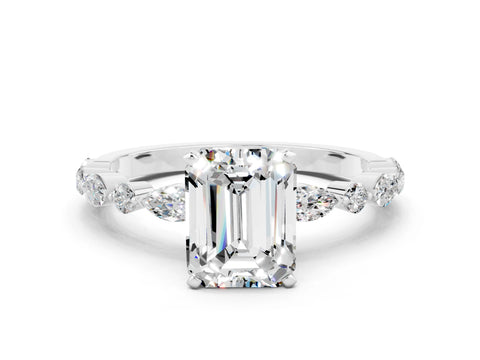 White gold Emerald Cut Moissanite Solitaire with Side Stones on a Pavé Band and Four-Prong Setting