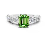 White gold Emerald Cut Peridot Prong Setting with Side Stones on a Pave Band