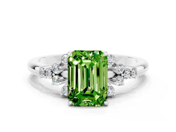 Platinum Emerald Cut Peridot Ring with Side Stones and Four-Prong Setting