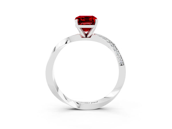 Silver Emerald Cut Ruby Engagement Ring with Side Stone Accents and Four-Prong Setting