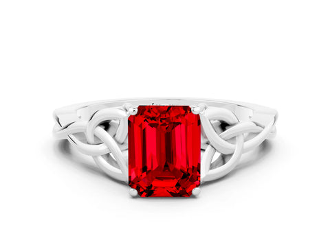 White gold Emerald Cut Ruby Solitaire Engagement Ring with Celtic Knot Band and Four-Prong Setting