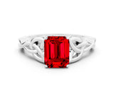 White gold Emerald Cut Ruby Solitaire Engagement Ring with Celtic Knot Band and Four-Prong Setting