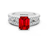 White gold Emerald Cut Ruby Solitaire Ring with Pavé and Channel Set Band