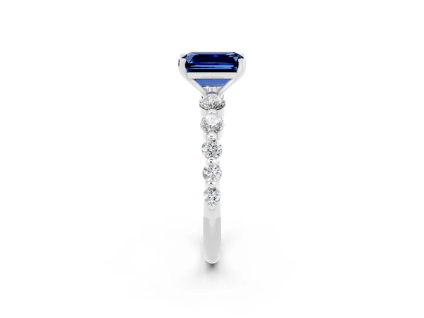 White gold Emerald Cut Solitaire Blue Sapphire Ring with Pave Band and Four-Prong Setting