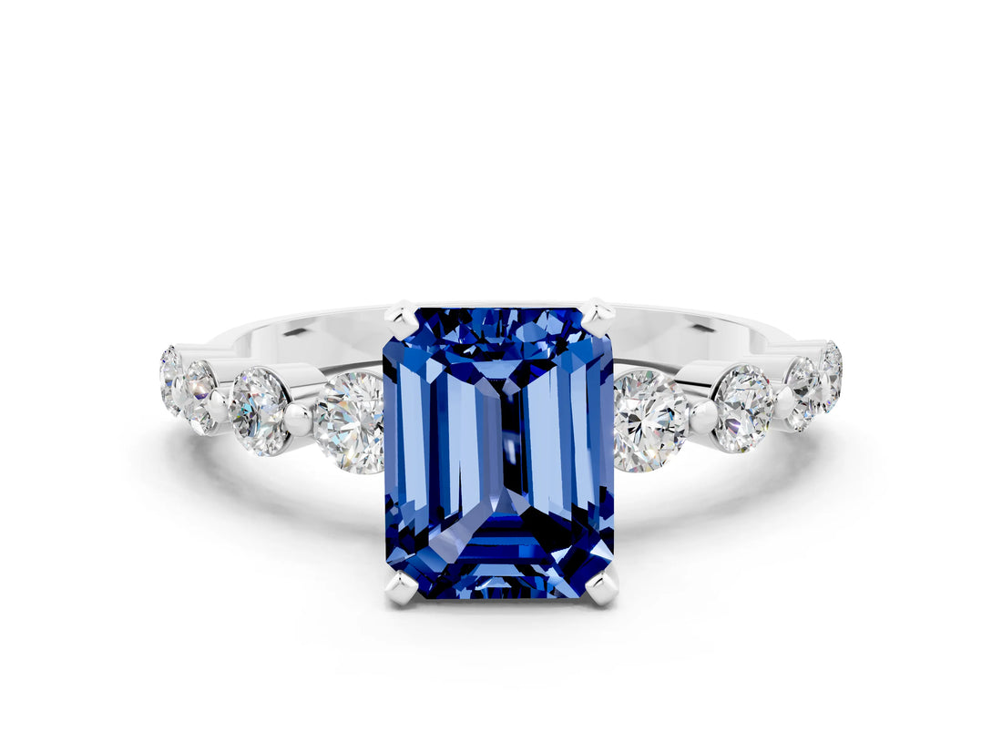 White gold Emerald Cut Solitaire Blue Sapphire Ring with Pave Band and Four-Prong Setting