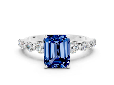 White gold Emerald Cut Solitaire Blue Sapphire Ring with Pave Band and Four-Prong Setting