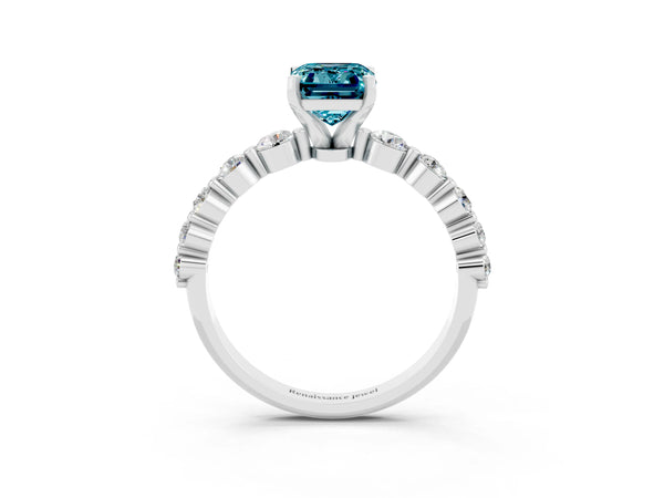White gold Emerald Cut Solitaire Blue Topaz Ring with Pave Band and Four-Prong Setting