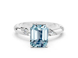 White gold Emerald Cut Solitaire Diamond Engagement Ring with Twisted Pave Band and Four-Prong Setting