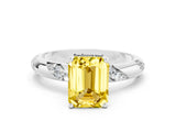 White gold Emerald Cut Solitaire Diamond Engagement Ring with Twisted Pave Band and Four-Prong Setting