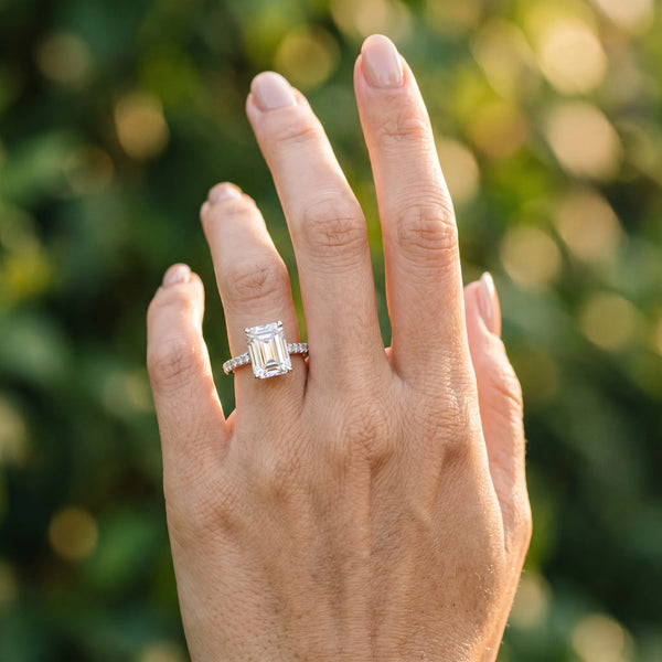 White gold Emerald Cut Solitaire Diamond Ring with Pave Band and Four-Prong Setting