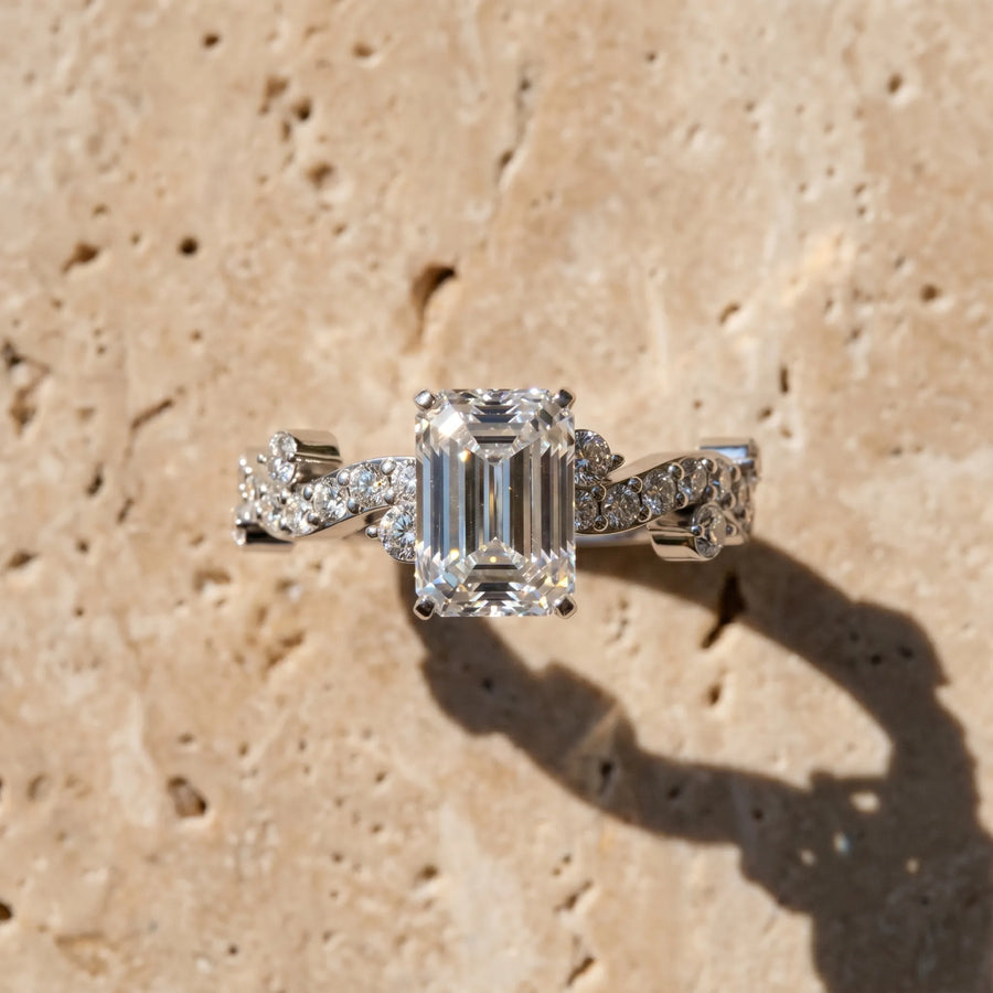 White gold Emerald Cut Solitaire Diamond Twisted Band with Pave Setting