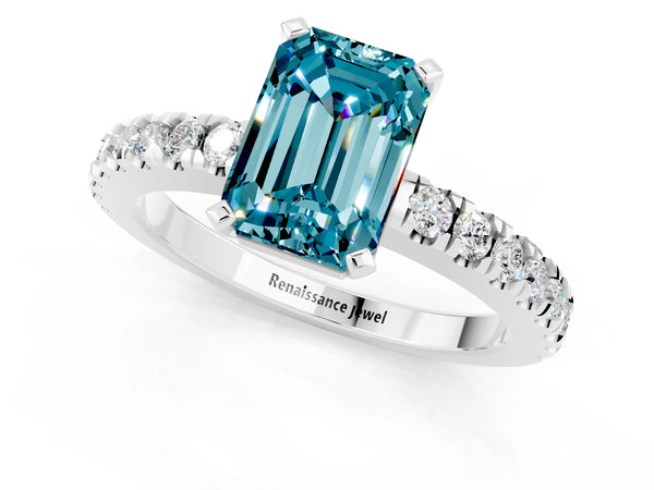 Platinum Emerald Cut Solitaire Blue Topaz with Pavé Band and Four-Prong Setting