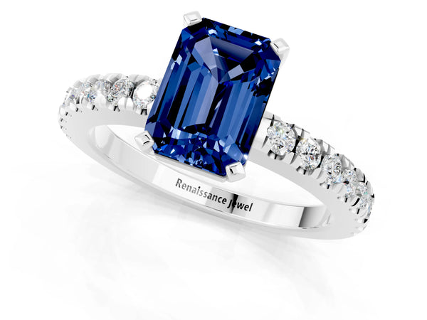 Platinum Emerald Cut Solitaire Blue Sapphire with Pavé Band and Four-Prong Setting
