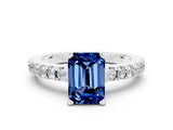 White gold Emerald Cut Solitaire Diamond with Pavé Band and Four-Prong Setting