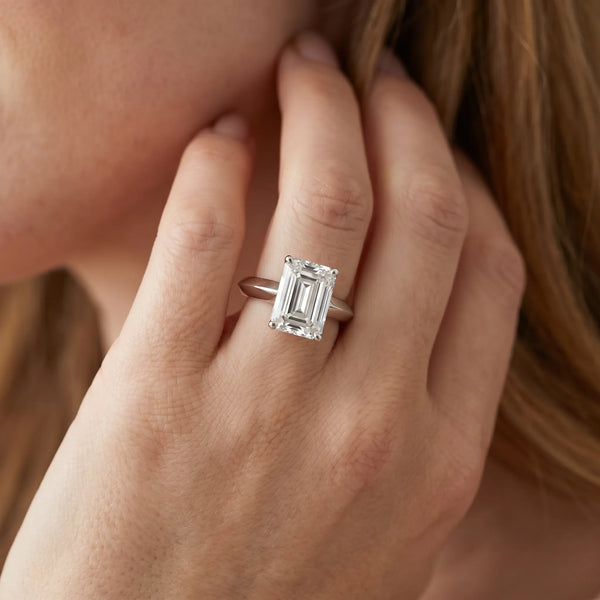 White gold Emerald Cut Solitaire Engagement Ring with Flat Band and Four-Prong Setting