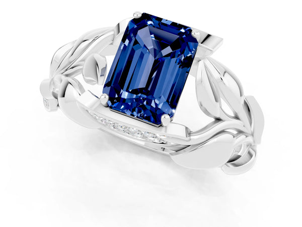 Platinum Emerald Cut Blue Sapphire Leaf-Inspired Engagement Ring with Round Accents and Prong Setting